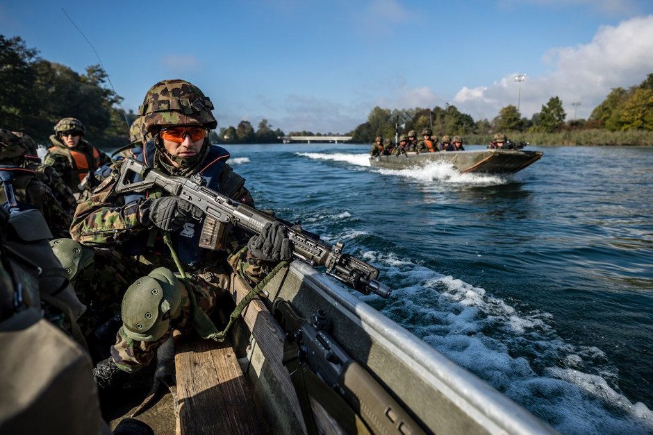 Switzerland infantry soldiers in a boat - Covert Shores